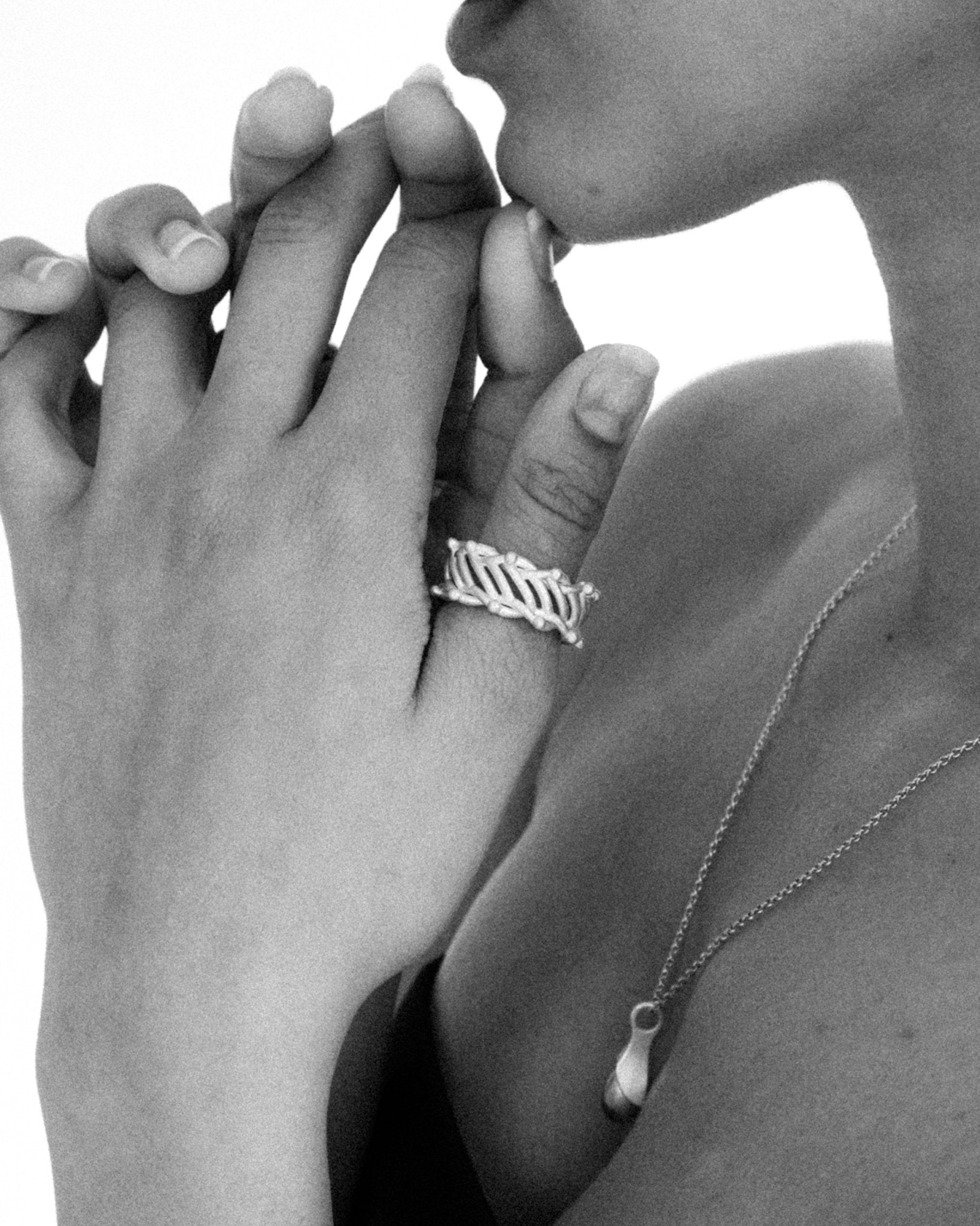 Modern artisan silver ring styled on model’s hand