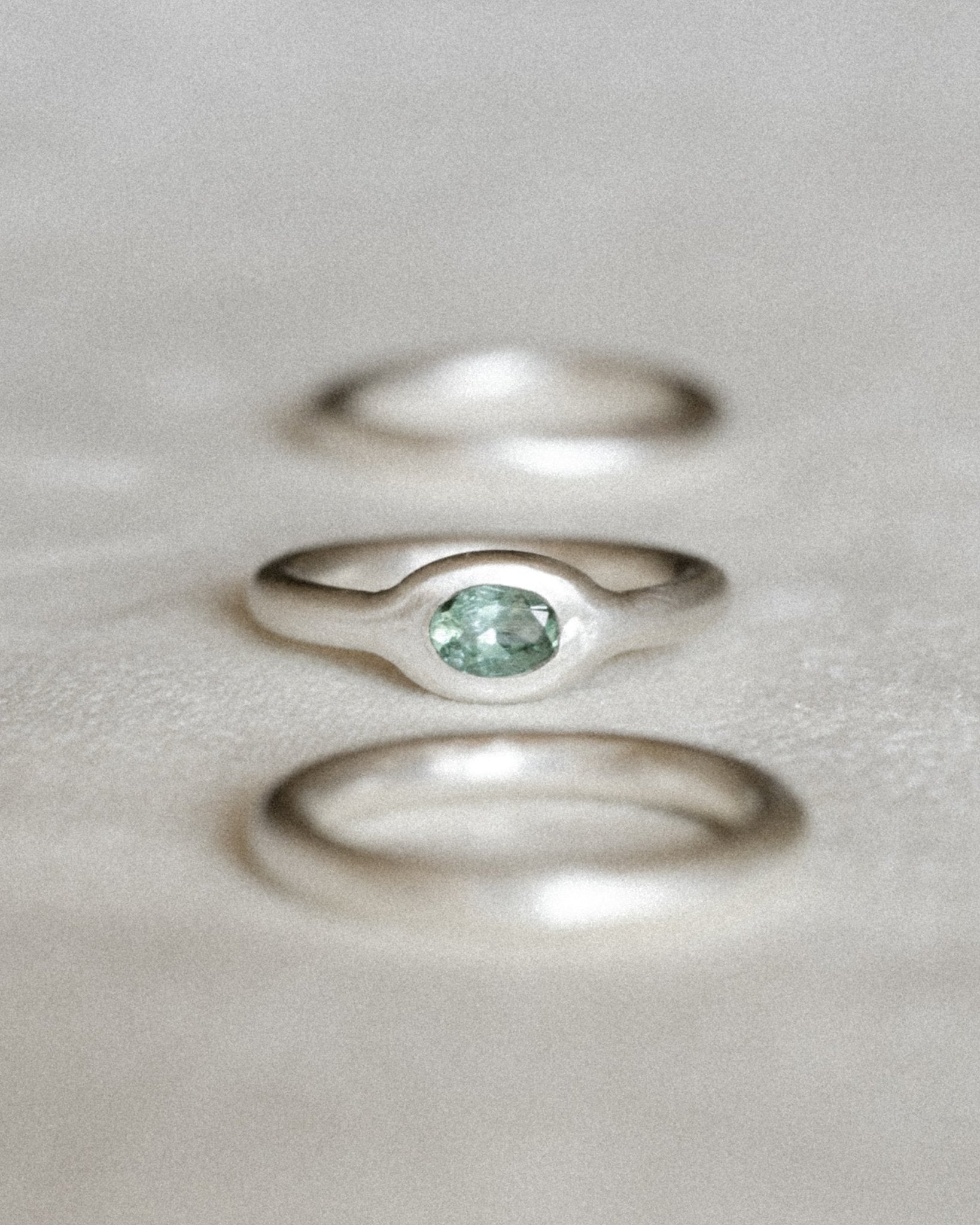Minimalist silver gemstone ring with rounded band