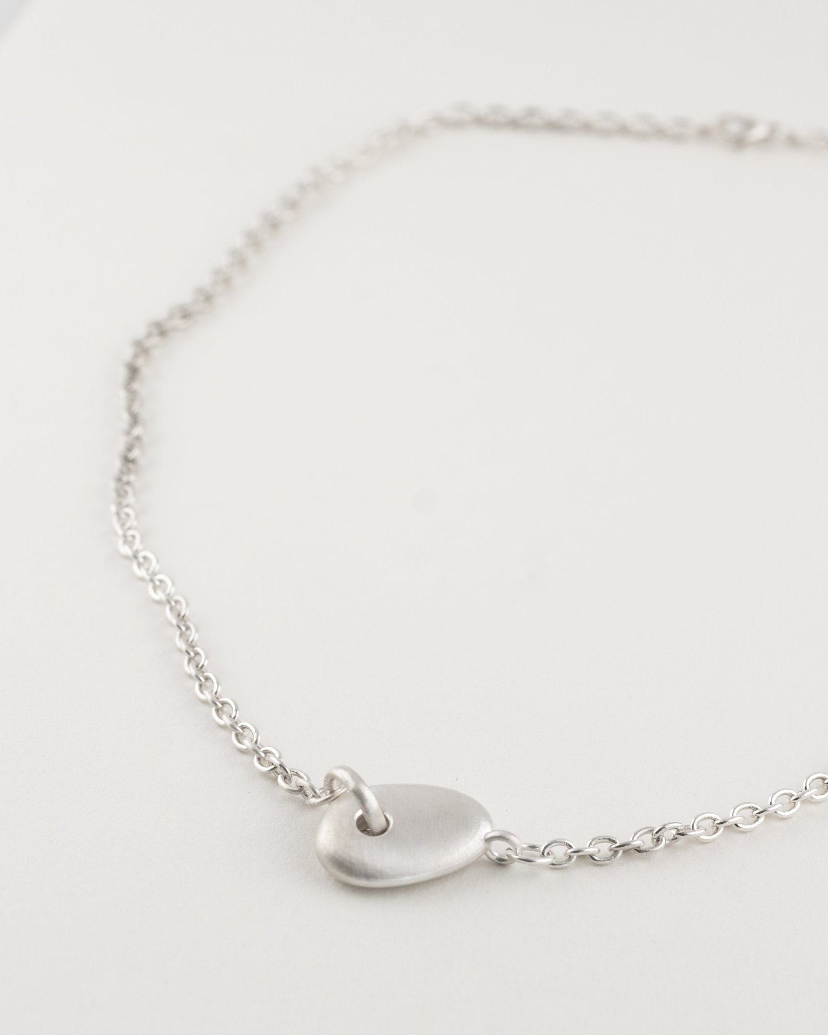 Auri Necklace close-up showing pendant and chain detail
