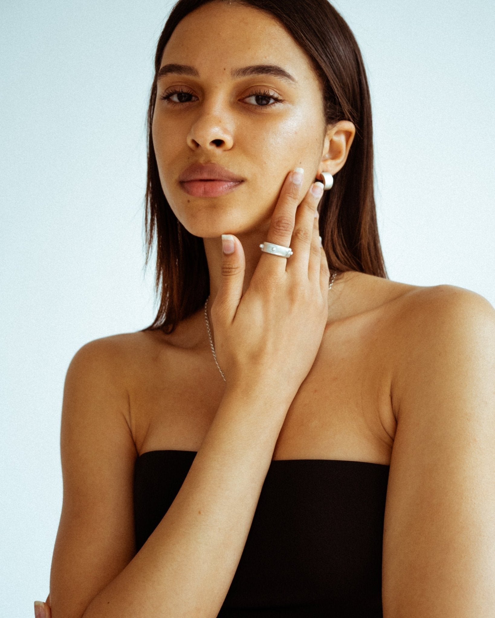 Hefty silver wide band featuring evenly spaced dot details