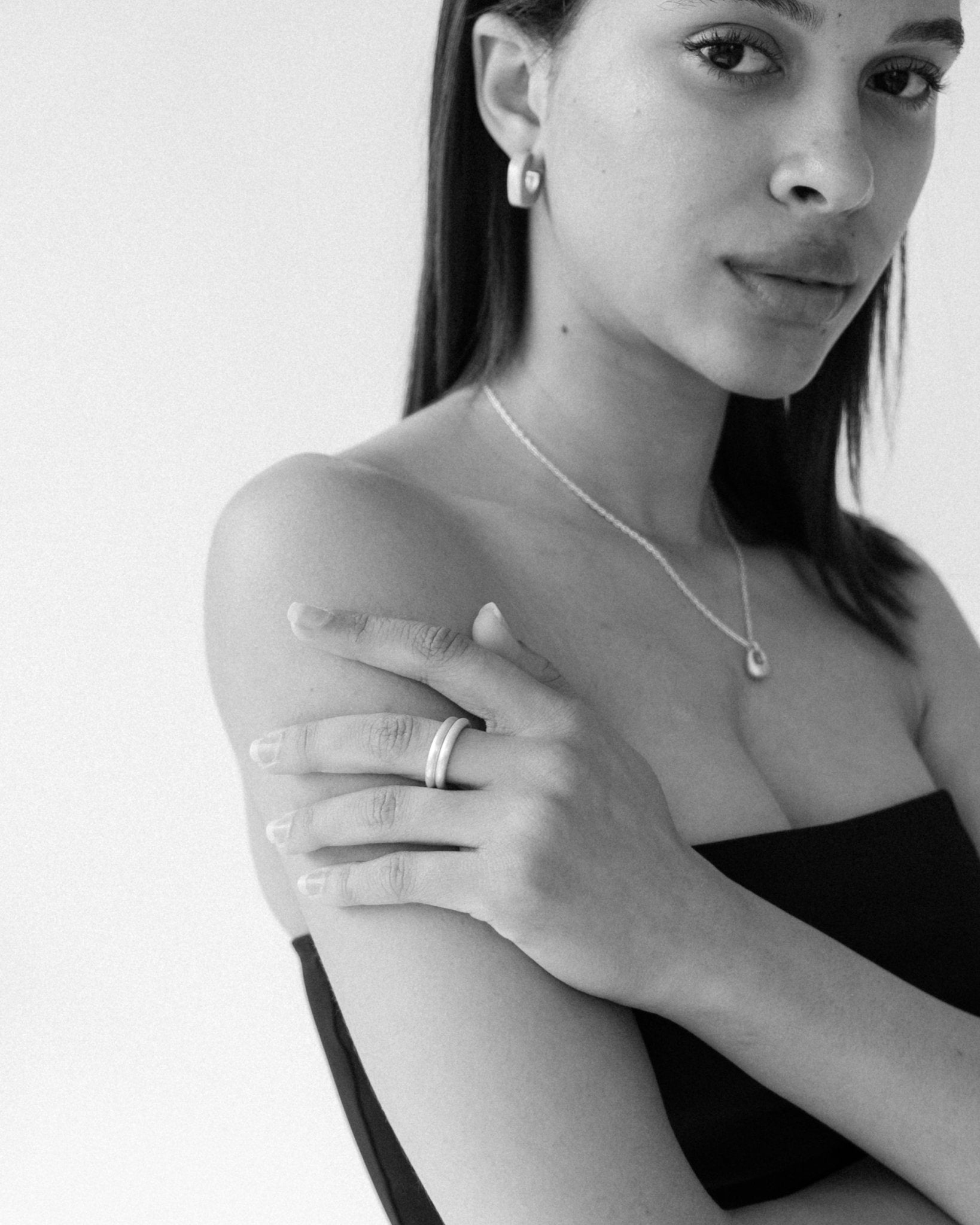 CKLASIC Pebble Necklace with purse-inspired sculptural design