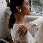 Lightweight silver hoops worn on model’s ear
