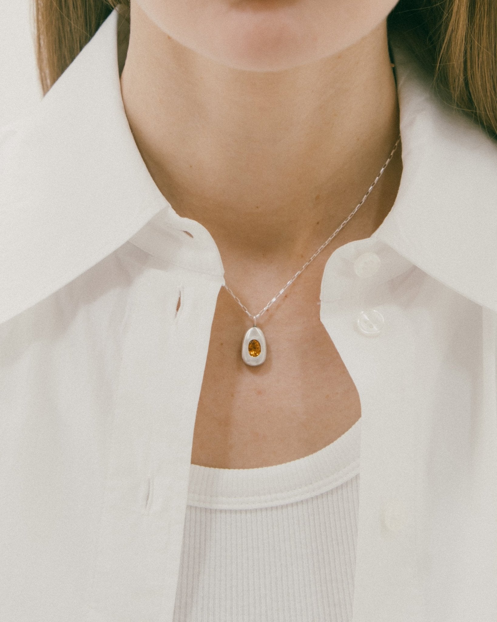Handcrafted silver necklace with egg-shaped charm
