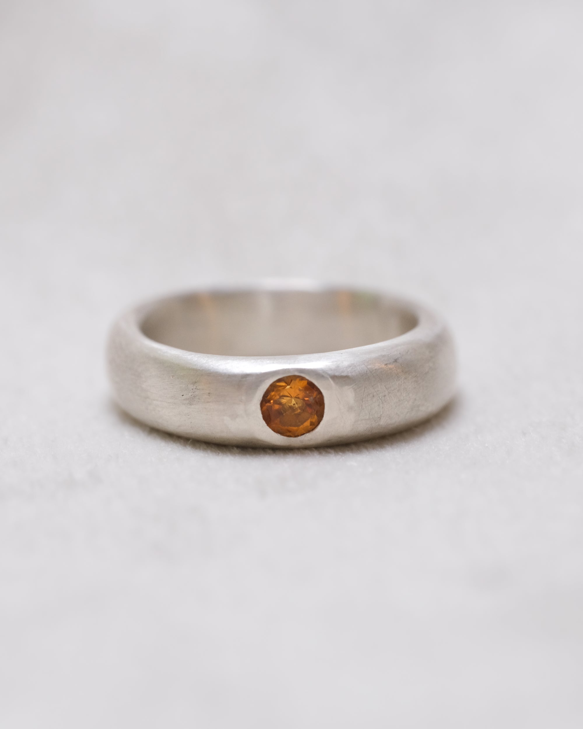 Minimalist silver band with gemstone accent