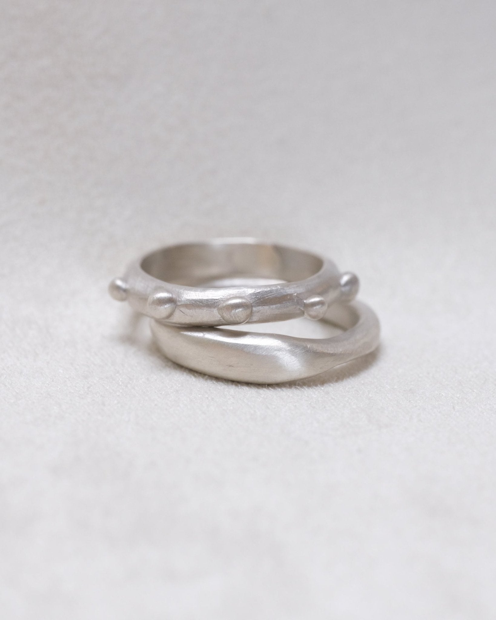 Sterling silver wave band paired with dotted ring