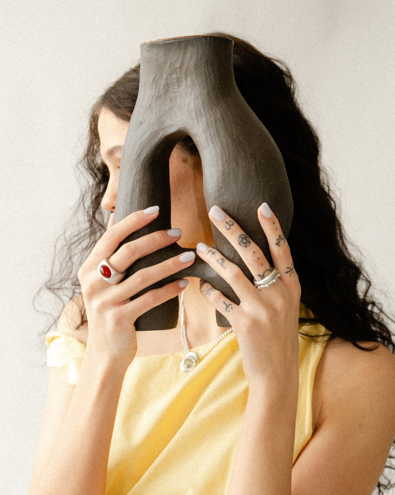 Sterling silver sculptural jewelry with liquid-like form