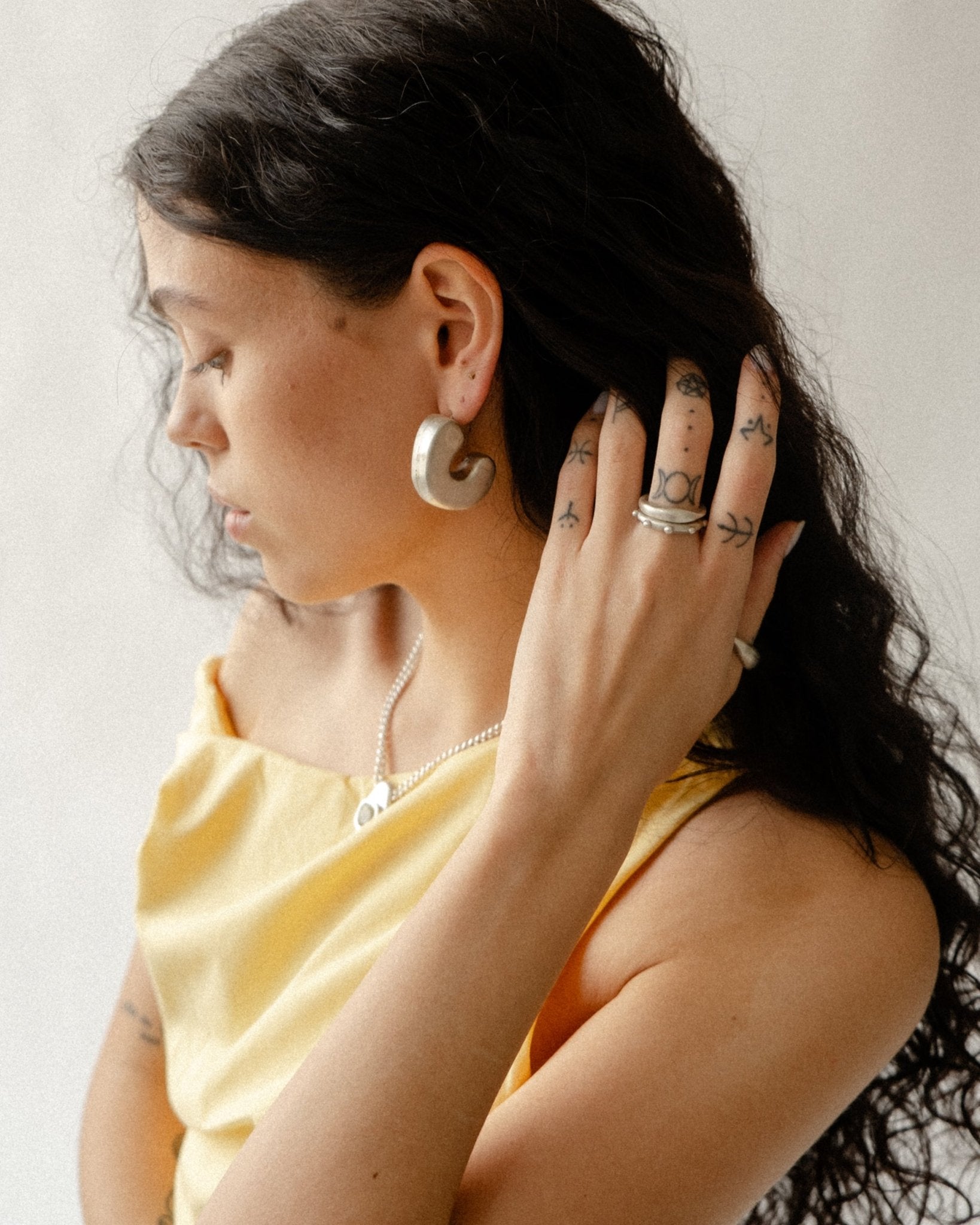 CKLASIC Wave & Dot duo photographed as versatile jewelry