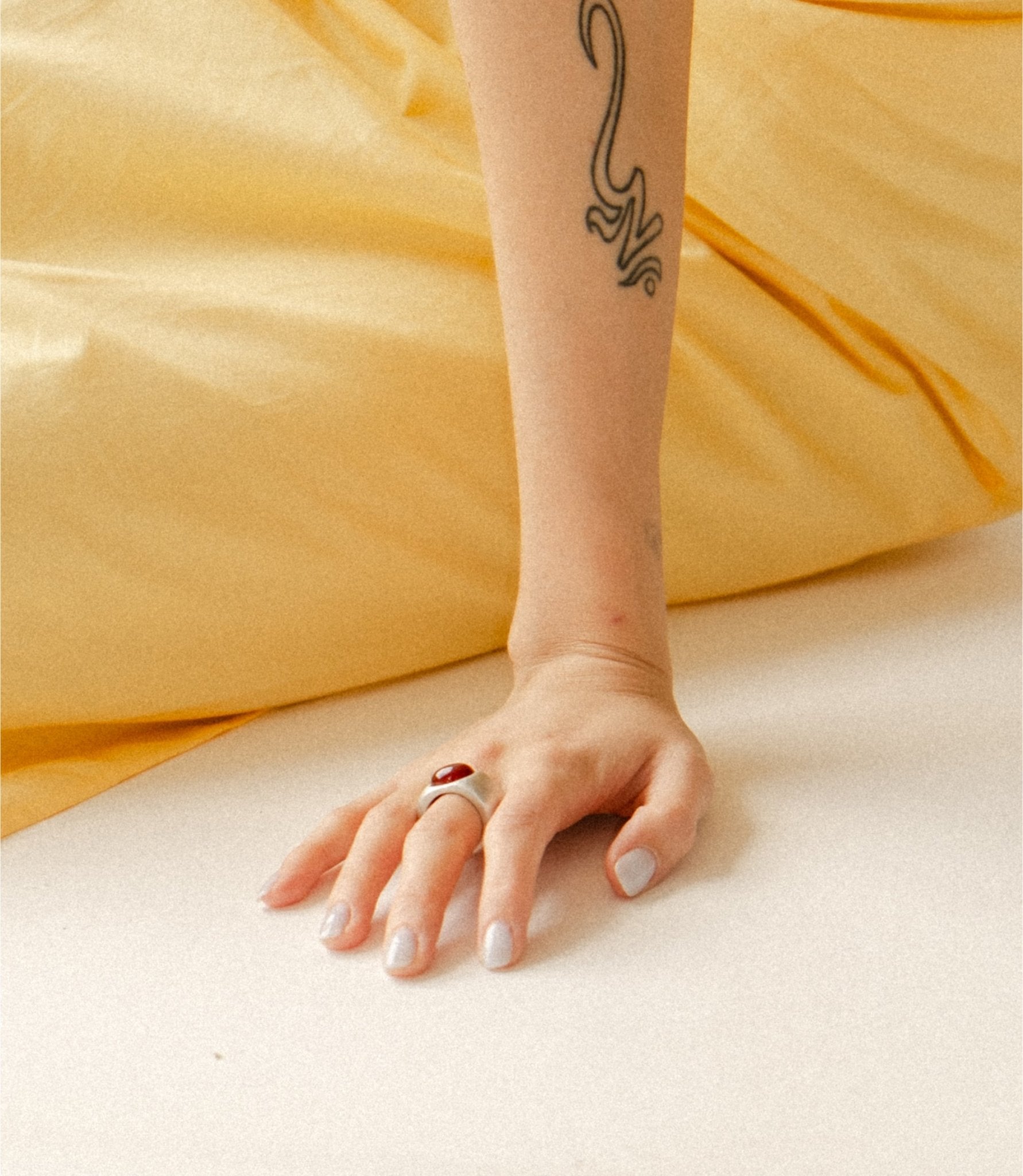 Kaia sculptural silver ring photographed styled on model