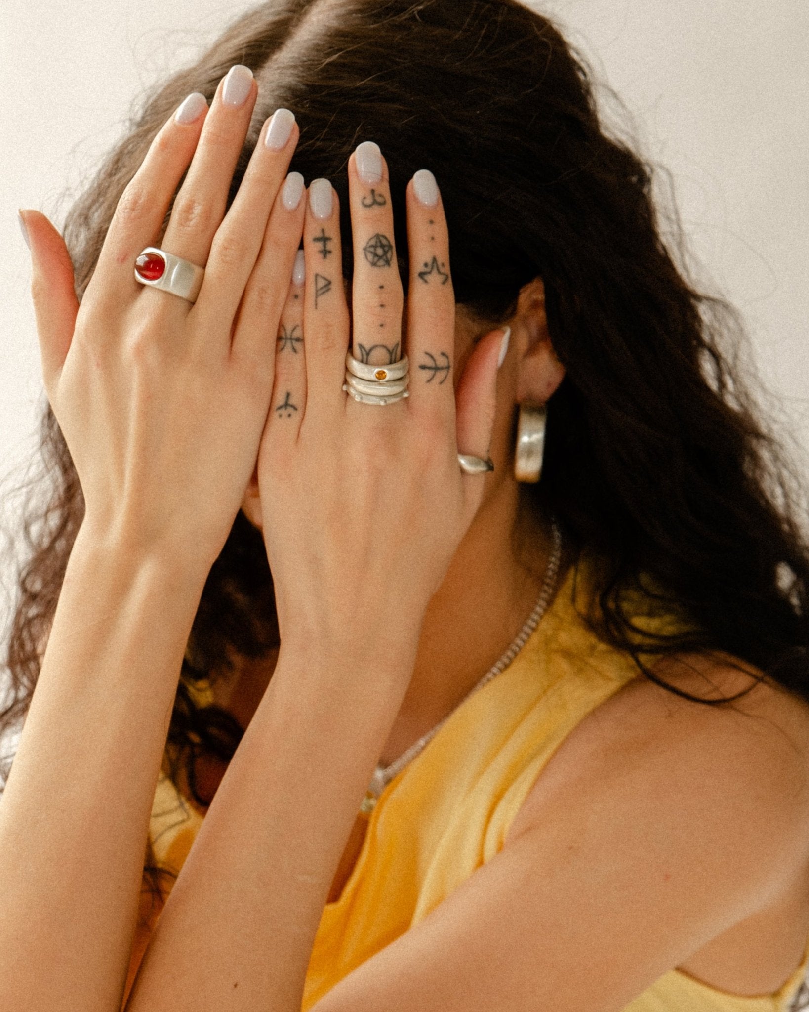 Sterling silver gemstone ring styled on model’s hand