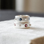 Wide 4‑stone sterling silver band featuring polished dot spacing