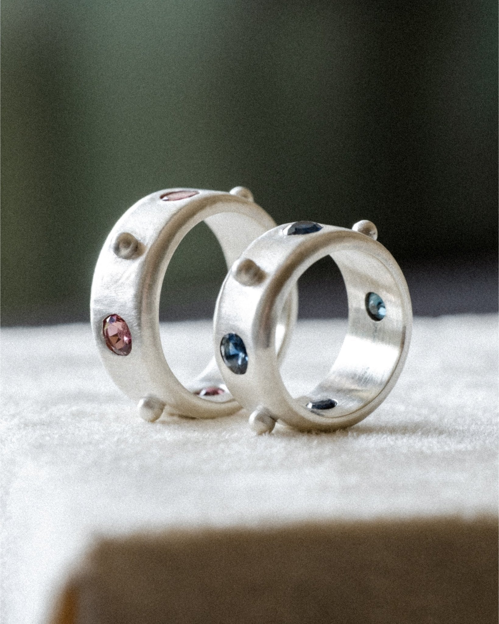 Sterling silver ring set with blue sapphires spaced by silver dots