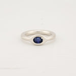 Handcrafted silver donut band ring with sapphire stone