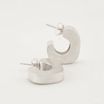 Bold silver hoop earrings with puffy curved design
