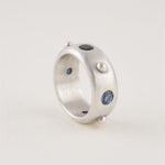 Fiora Ring wide sterling silver band with four 4mm gemstones