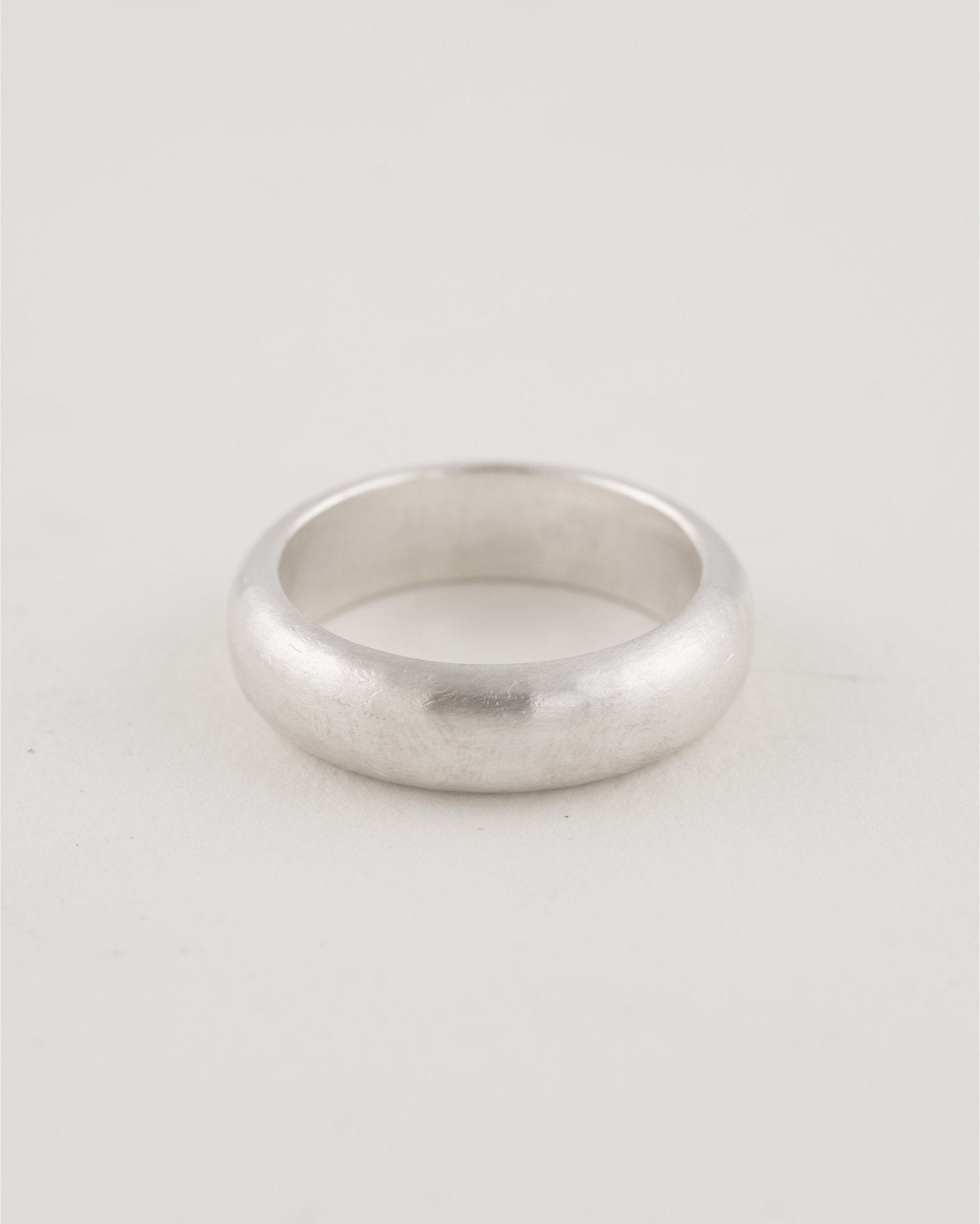 Minimal modern sterling silver ring styled as a pinky band