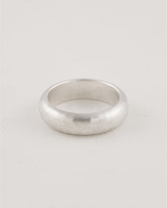 Minimal modern sterling silver ring styled as a pinky band
