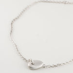 Auri Necklace close-up showing pendant and chain detail