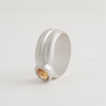 Sterling silver band ring with modern bezel setting