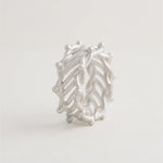 Openwork silver ring with dotted border accents