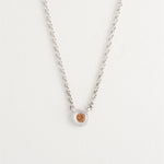 Delicate sterling silver necklace styled on model’s neck