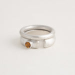 Sterling silver Ovie cutout ring paired with Donut band