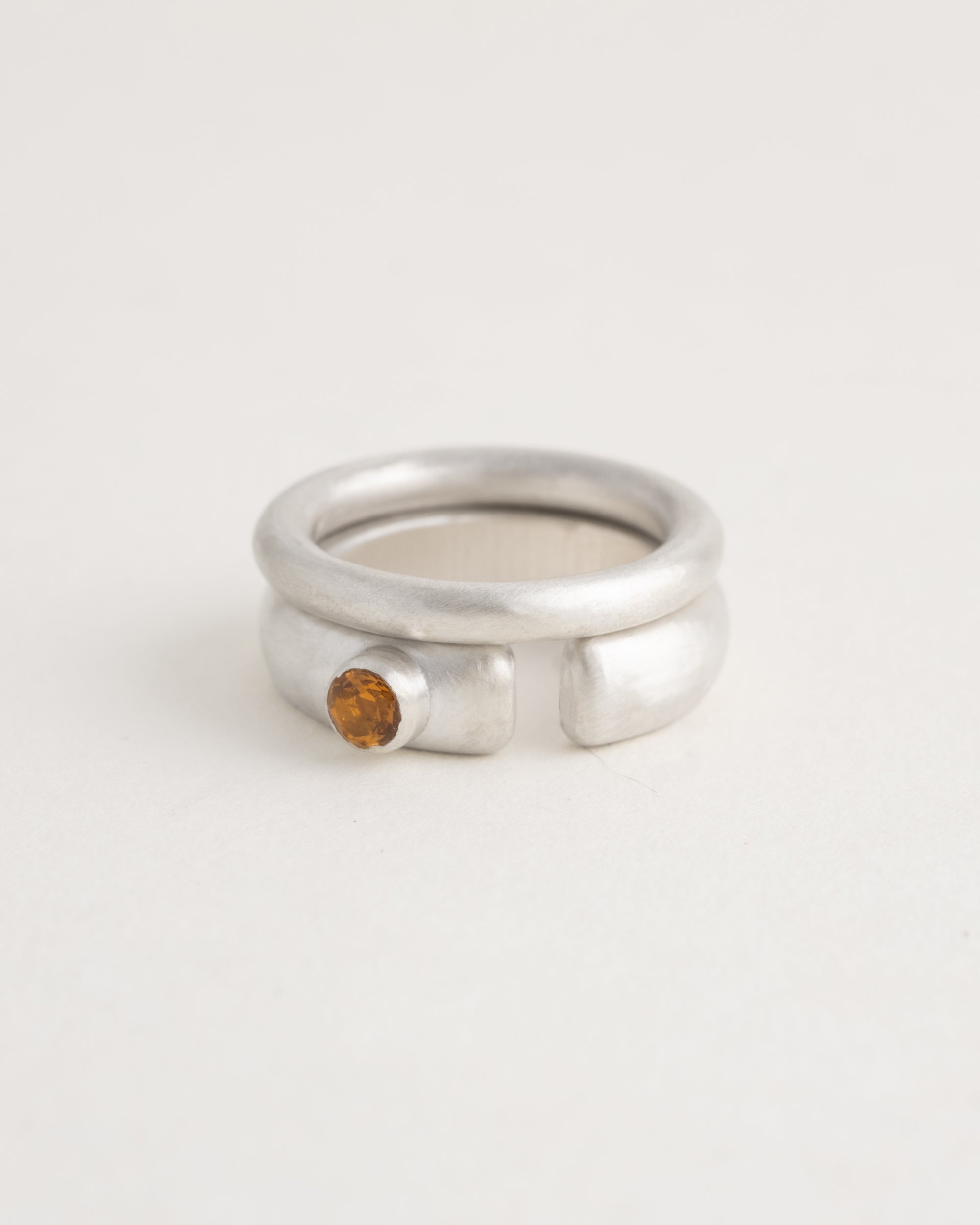 Sterling silver Ovie cutout ring paired with Donut band