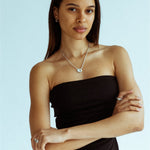Solid sterling silver half hoops styled on model’s ear