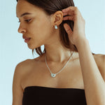 CKLASIC Arc earrings with streamlined sculptural design