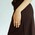 Minimalist silver stacking rings styled together