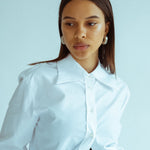 Statement hoop earrings in polished silver against white background